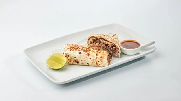 classic beef burrito with beans rice and cheese