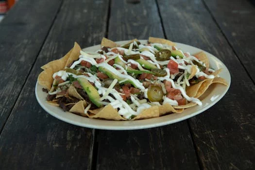loaded nachos cheese guacamole peppers